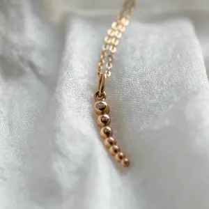 Close-up of the CLAUDE pendant and delicate chain