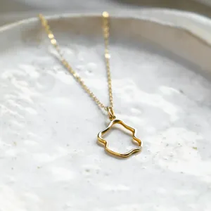 Angled close-up of the DOMINIQUE minimalist diamond necklace pendant
