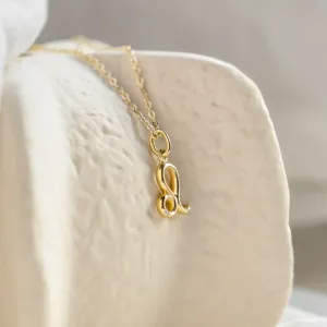 Angled close-up of the Leo necklace and diamond pendant