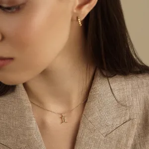 Close-up of the GEMINI diamond necklace worn at the neck