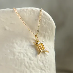 Angled view of the GEMINI diamond zodiac necklace
