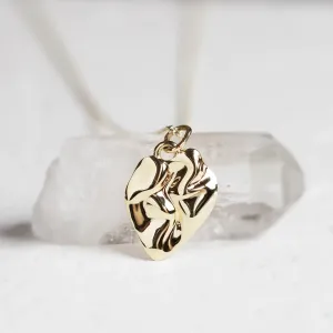 Close-up of the irregular heart-shaped MARGUERITE pendant