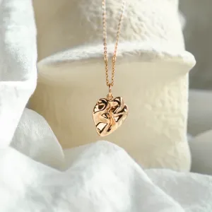 Gold MARGUERITE necklace with an irregular heart-shaped pendant