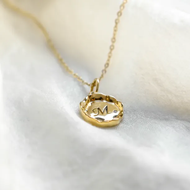 Low angled view of the COLETTE personalised gold pendant with diamond
