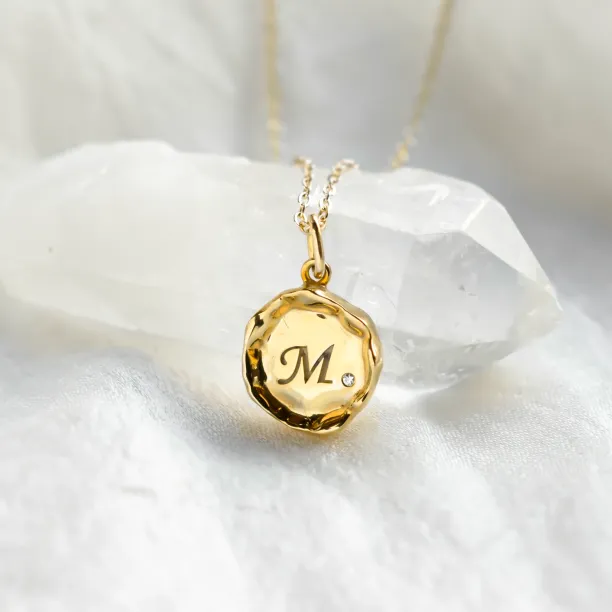 COLETTE personalised diamond necklace with a gold pendant engraved with M