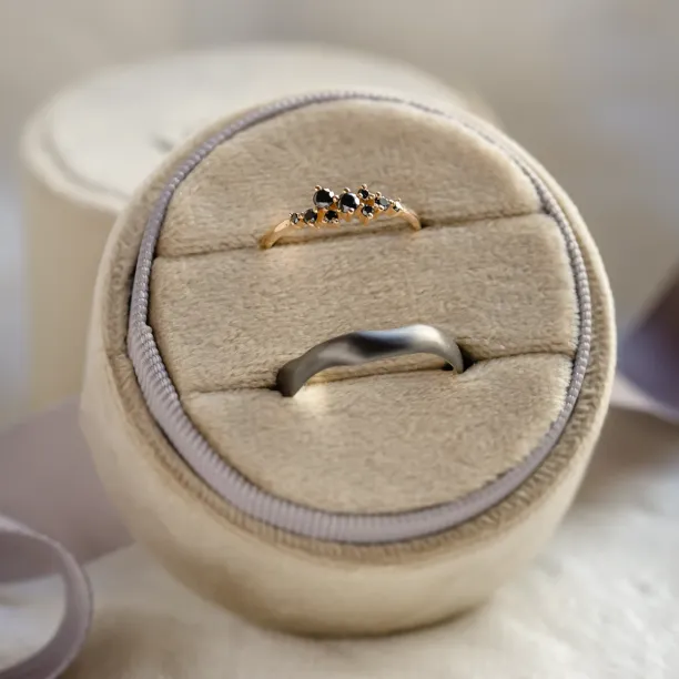 DUE wedding ring pair with black diamonds and an organic black rhodium band