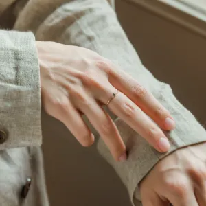 SABINE sapphire and diamond ring shown on a hand