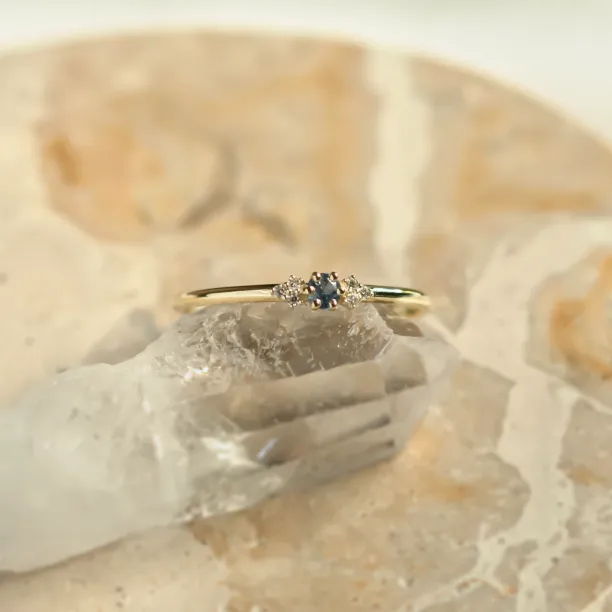 Close-up of the SABINE sapphire and diamond ring