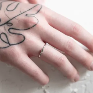 SABINE sapphire and diamond ring worn on a hand