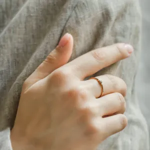 SABINE sapphire and diamond ring worn on a hand, angled view
