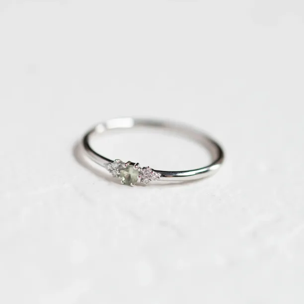 SABINE minimalist sapphire and diamond ring in an angled view