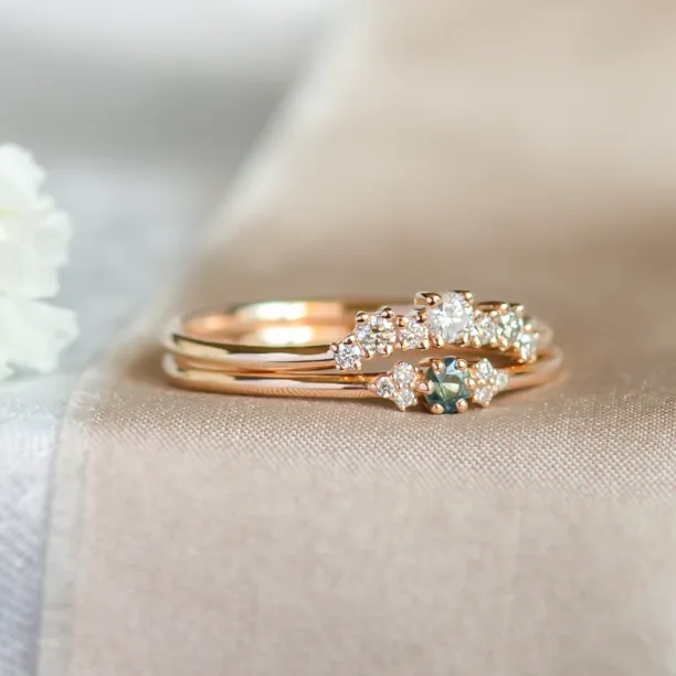 Close-up of the SABINE ring with teal sapphire and diamonds