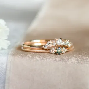Close-up of the SABINE ring with teal sapphire and diamonds