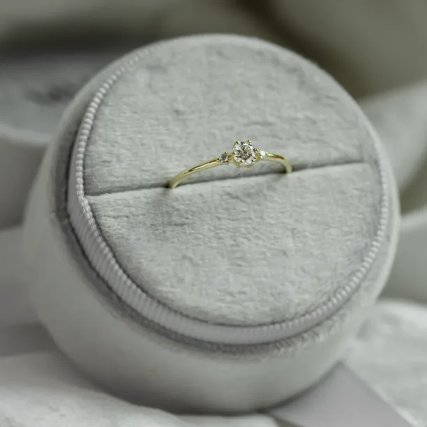 ALICIA gold engagement ring with three diamonds, angled view