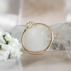 ALICIA gold engagement ring, showing the side of its diamond setting