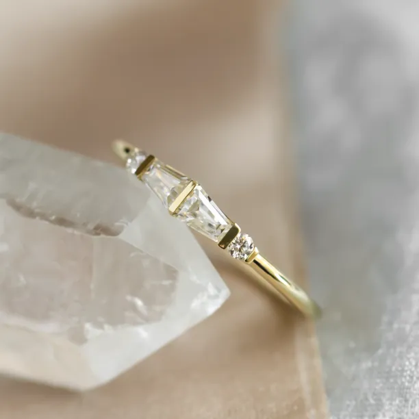 Close-up angled view of LUMI ring with tapered baguette moissanites