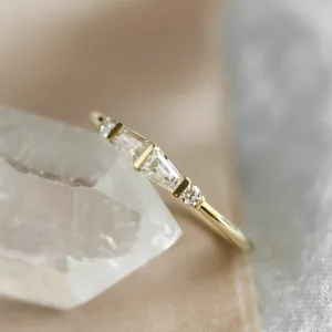 Close-up angled view of LUMI ring with tapered baguette moissanites