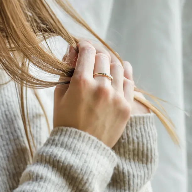 LUMI gold moissanite ring worn on the hand