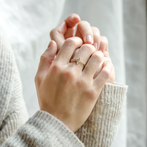 THEA engagement ring with three baguette moissanites worn on the hand