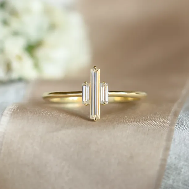 THEA gold engagement ring with three baguette moissanites, clear front view