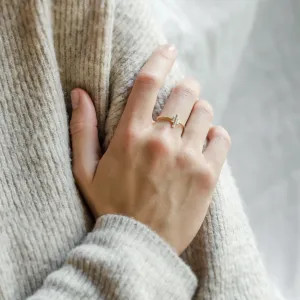 THEA engagement ring with three baguette moissanites worn on a hand