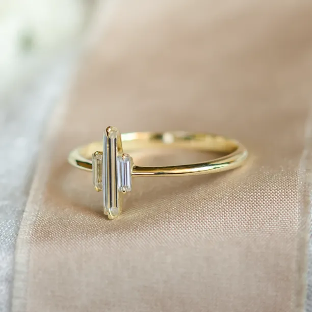 Side view of the THEA gold engagement ring with three baguette moissanites