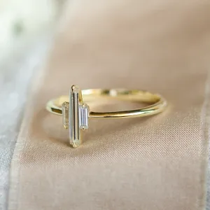 Side view of the THEA gold engagement ring with three baguette moissanites