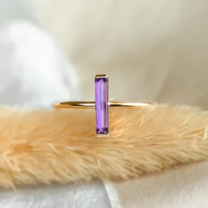 Close-up of the NYX gold ring with baguette amethyst