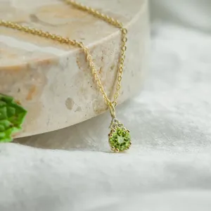 Close-up of the gold peridot and diamond pendant