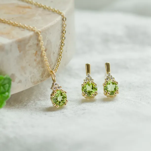 Gold peridot and diamond pendant with matching earrings from the VERT collection
