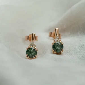 Close-up of TIA gold earrings with moss agate and diamonds