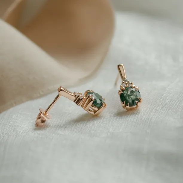 Angled view of TIA gold earrings showing the post and fastening