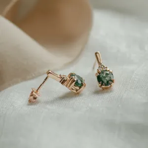 Angled view of TIA gold earrings showing the post and fastening