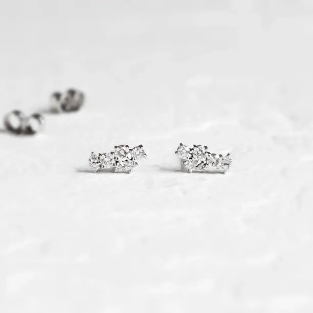 Close-up of gold diamond earrings from the ELLY jewellery set
