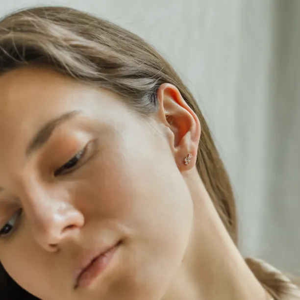 Diamond cluster earring ELIN worn on the ear