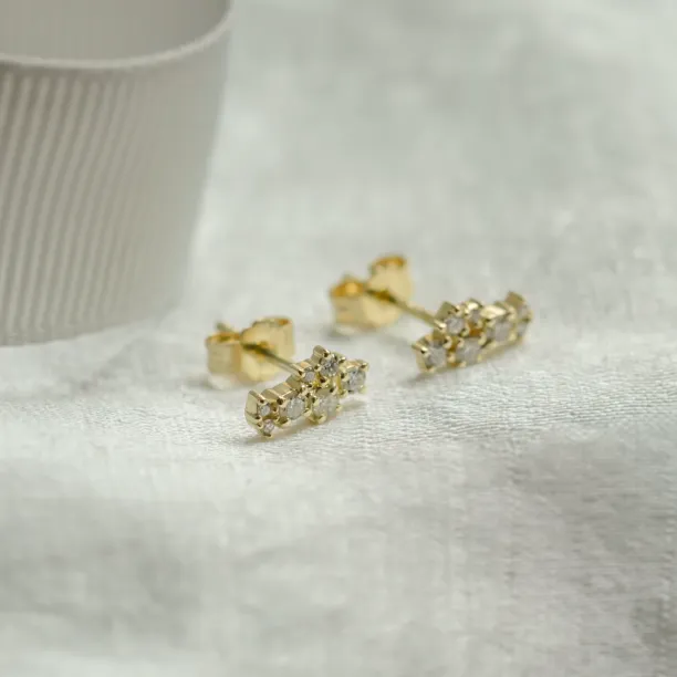 Angled view of diamond cluster earrings ELIN showing the posts