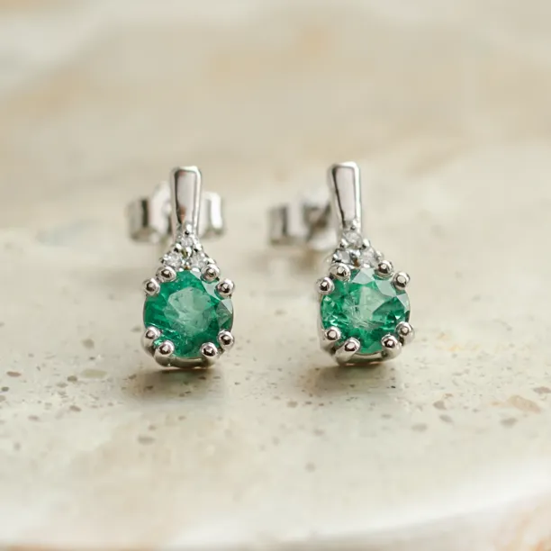 LENNY gold earrings with emeralds and diamonds, shown as a pair