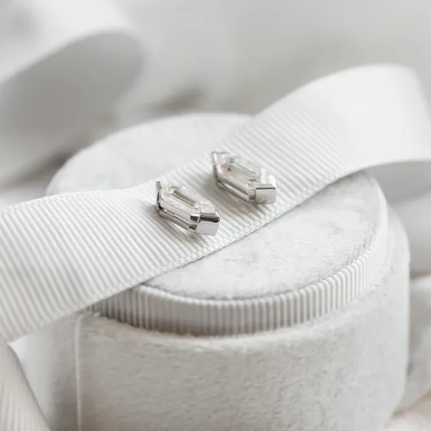 Angled close-up of the SERENA geometric moissanite earrings