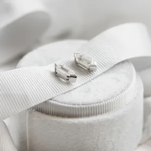 Angled close-up of the SERENA geometric moissanite earrings