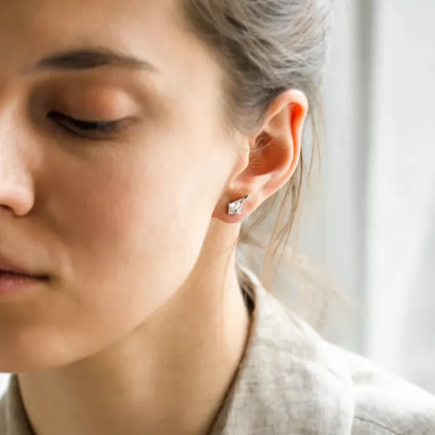 Gold kite moissanite earring DANE worn on the ear