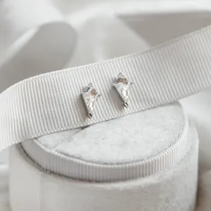 Angled view of the gold kite moissanite earrings DANE
