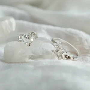 DANE gold kite moissanite earrings beside a matching ring