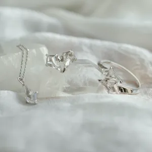 DANE gold kite moissanite earrings shown with a matching necklace and ring