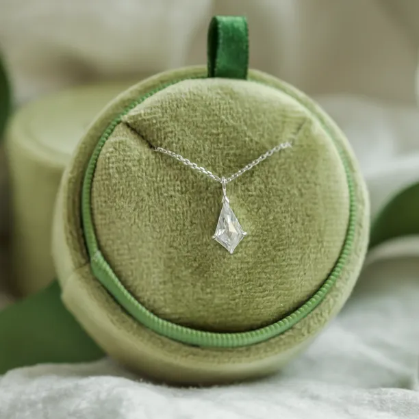 Gold DIONA pendant with kite-shaped moissanite on its chain