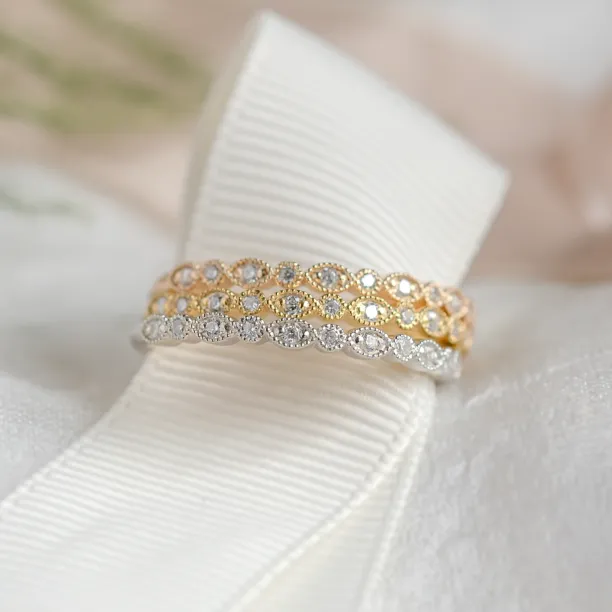 Three RIGA eternity rings with lab-grown diamonds displayed together