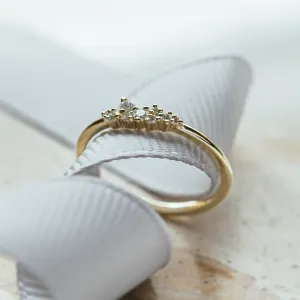 Angled view of the STERN gold ring and its lab created diamond cluster