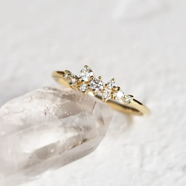 Angled view of the 14K yellow gold CLORÉ diamond cluster ring