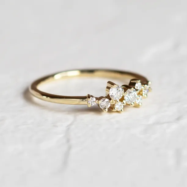 Angled close-up of the CLORÉ gold cluster ring with diamonds