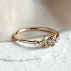Close-up of the CLORÉ cluster ring with diamonds in a gold band