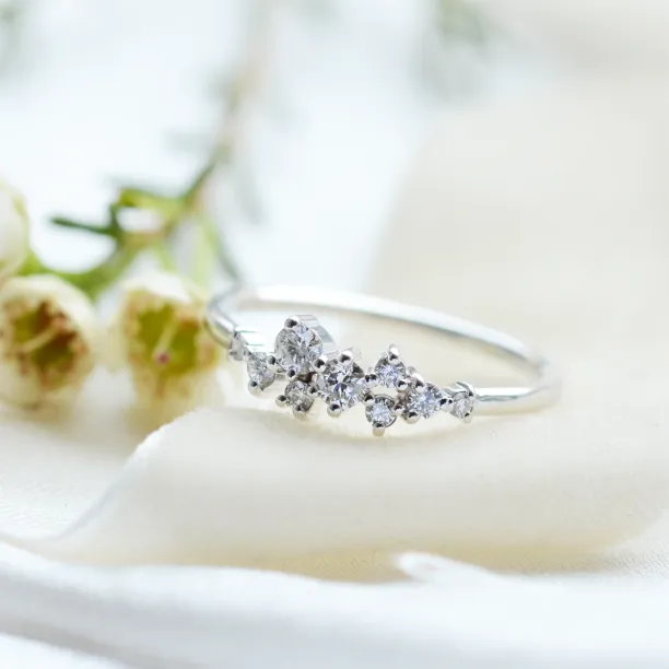 Angled view of the CLORÉ gold cluster ring with diamonds